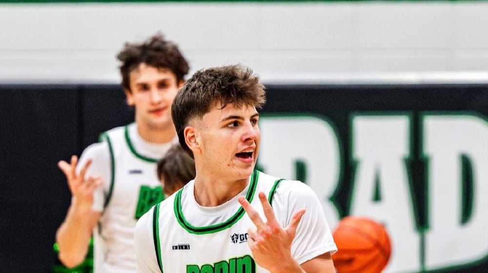 Badin’s Eli Stroud celebrates after hitting a 3-pointer against McNicholas on Friday night at Mulcahey Gym. ELIJAH COOK / CONTRIBUTED