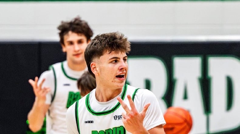 Badin’s Eli Stroud celebrates after hitting a 3-pointer against McNicholas on Friday night at Mulcahey Gym. ELIJAH COOK / CONTRIBUTED