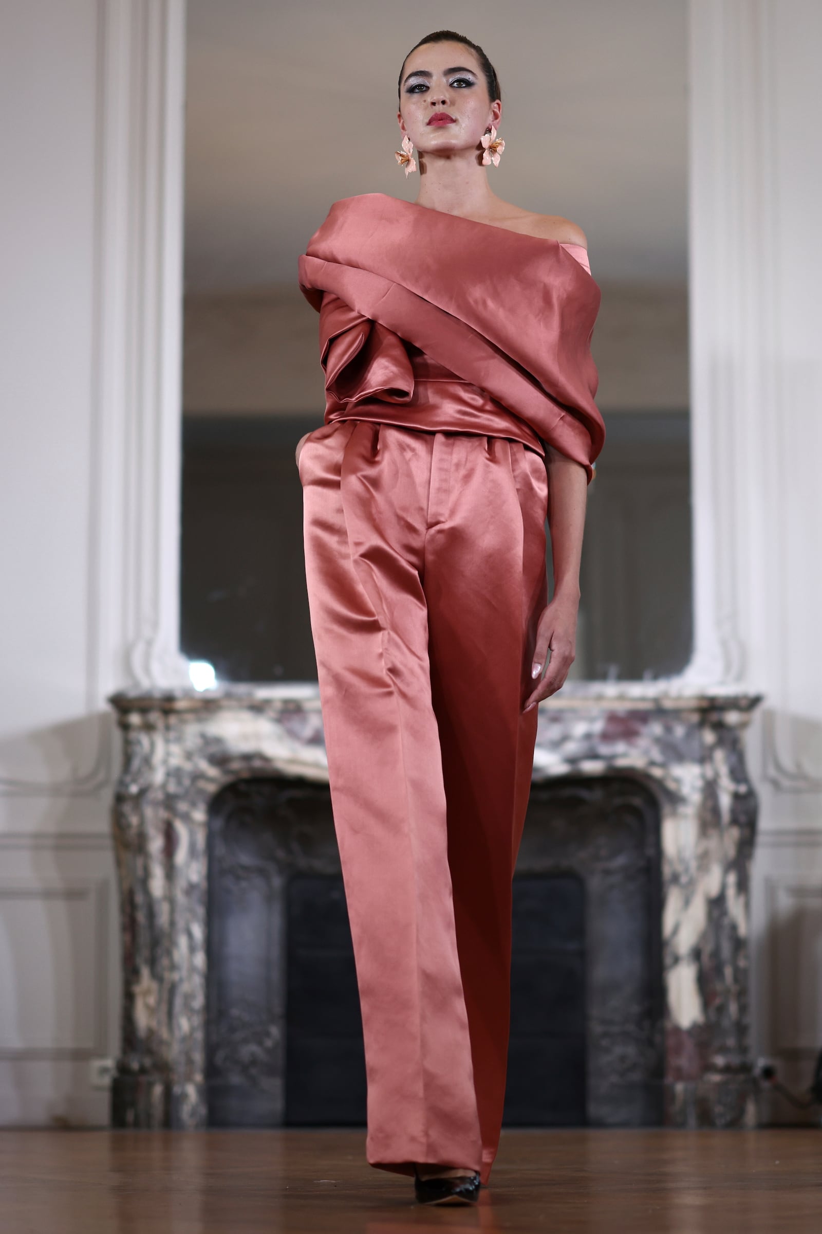 A model wears a creation as part of the Imane Ayissi Fall-Winter 2025/26 Haute Couture collection presented Monday, July 7, 2025, in Paris. (AP Photo/Tom Nicholson)