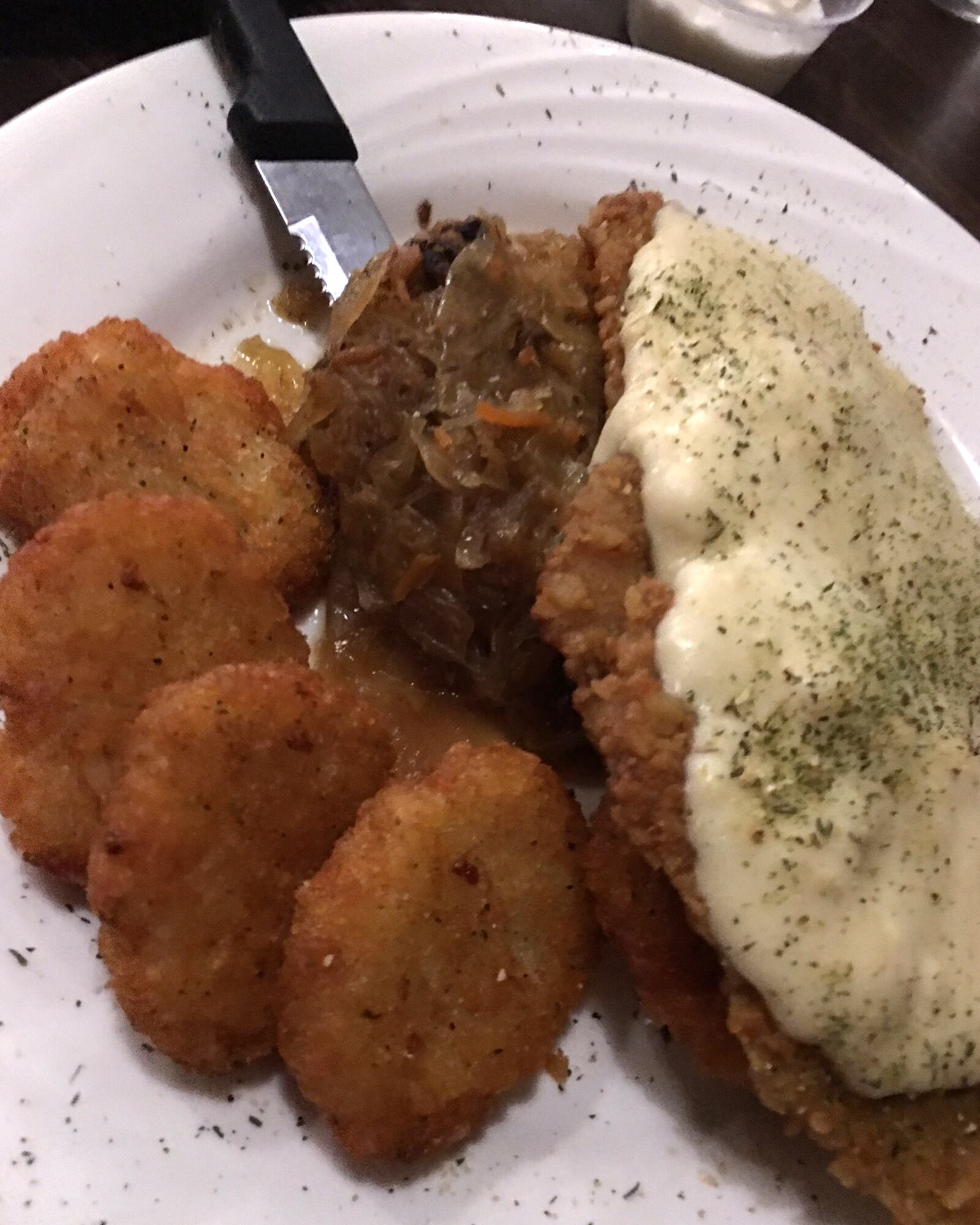 The Hunter Schnitzel ($16), a pretzel crusted pork loin, sautÃ©ed and topped with Dijon cream sauce served with potato pancakes and house sauerkraut.  ALEXIS LARSEN / CONTRIBUTED PHOTO