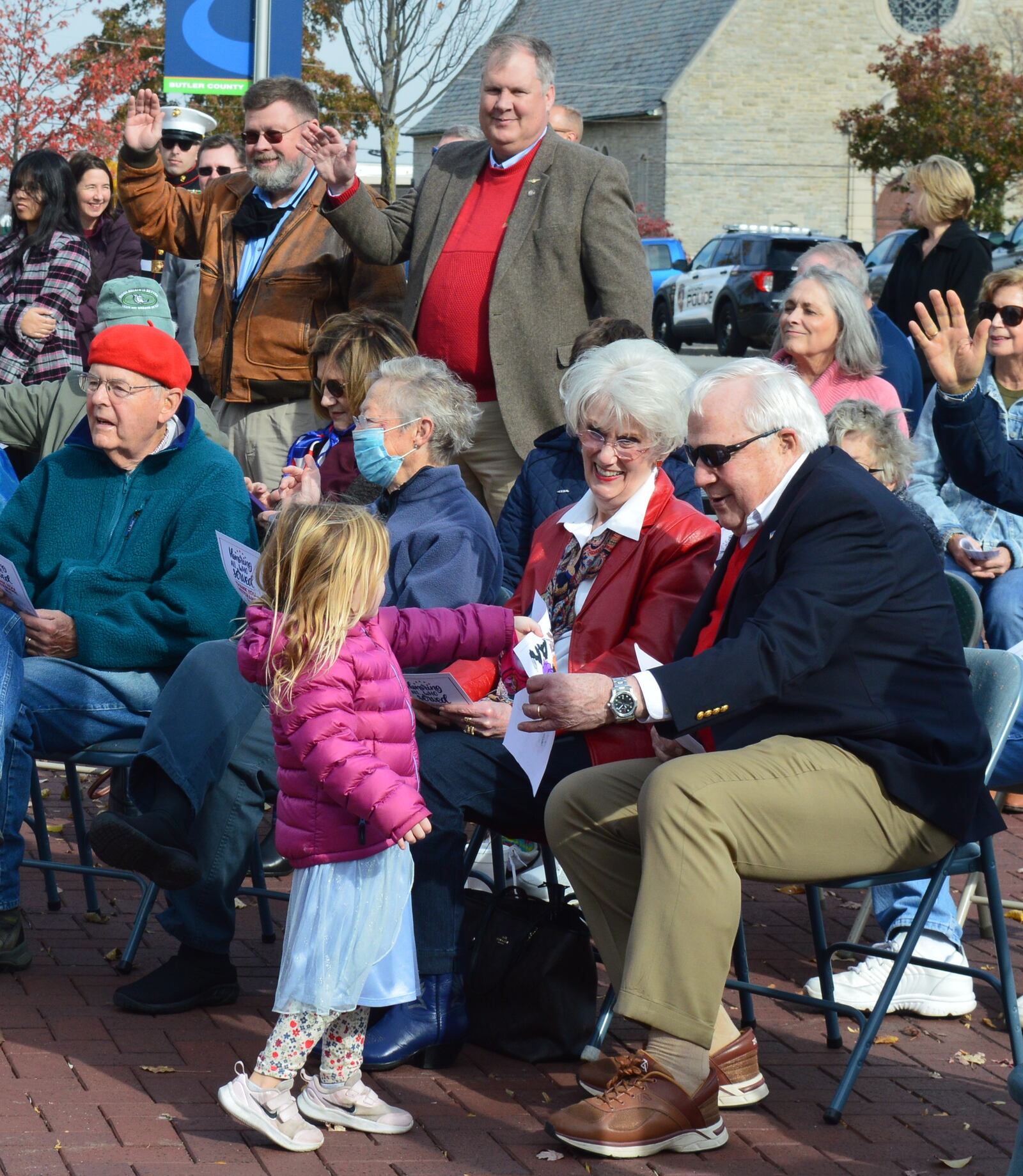 Members of the Oxford Parks and Recreation Department’s Learning Blocks Preschool Class presented pictures they had made to veterans present at the city’s Veterans Day ceremony. The presentation came after the class led the Pledge of Allegiance. Shown receiving one of those pictures is retired Air Force Col. Ron Schloemer, who later provided a veteran’s message in the program. CONTRIBUTED/BOB RATTERMAN