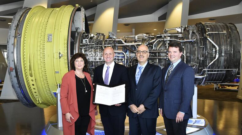 West Chester-based GE Additive, a GE Aviation subsidiary signed a five-year cooperative research and development agreement (CRADA) partnership agreement with the U.S. Department of Energy’s Oak ridge National Laboratory, on Monday, Oct. 28, 2019. Pictured, left to right, are Christine Furstoss, chief technology officer, GE Additive; Daniel Simmons, assistant secretary, U.S. Dept of Energy; Moe Khaleel, senior executive, associate laboratory director for energy and environmental sciences, Oak Ridge National Laboratory; Chris Schuppe, general manager, GE Additive. NICK GRAHAM/STAFF