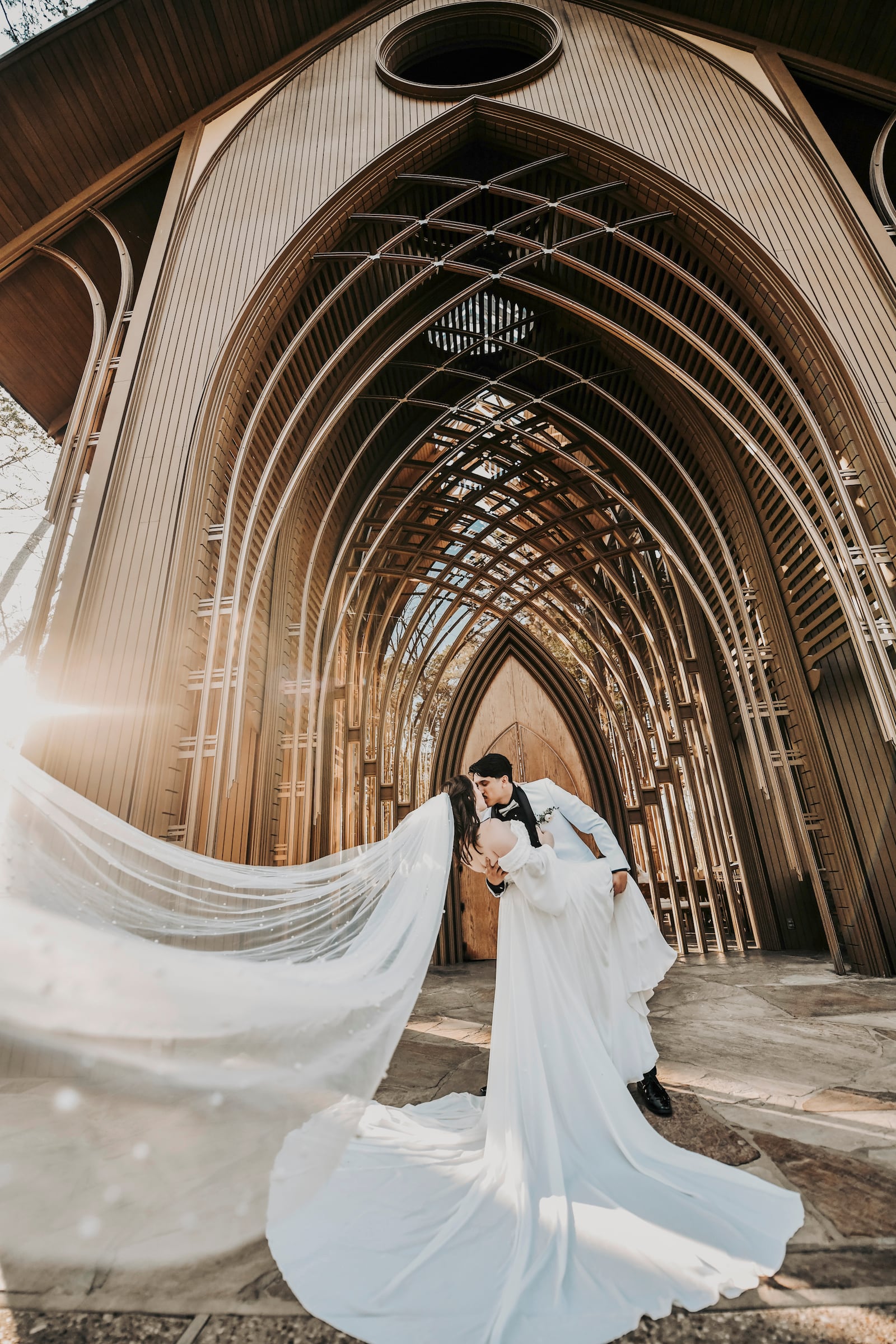 Maddy and Kaden Elfstrom embrace in Bella Vista, Arkansas, on their wedding day on April 12, 2025. (April Pinto Photography via AP)