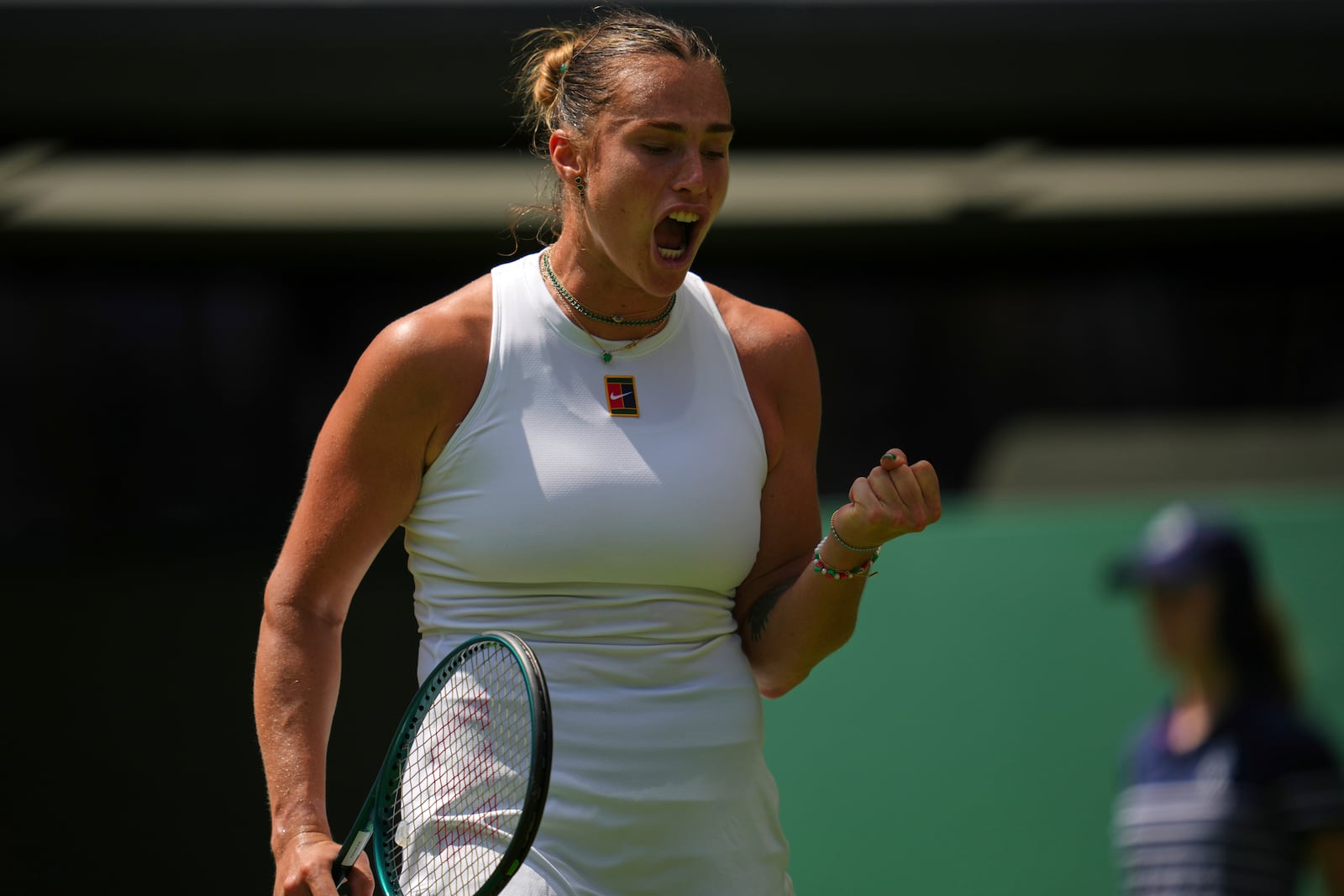 Aryna Sabalenka of Belarus reacts during her match against Carson Branstine of Canada at their first round women's single match at the Wimbledon Tennis Championships in London, Monday, June 30, 2025. (AP Photo/Kin Cheung)