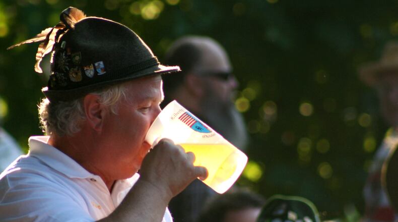 Walt Pegram, President of the Germania Society of Cincinnati, takes a drink of beer during the 2008 Oktoberfest held in Hamilton Saturday evening, August 30. The last day of the event is Sunday from 1pm-10pm. Photo by Jessica Uttinger, contributing photographer