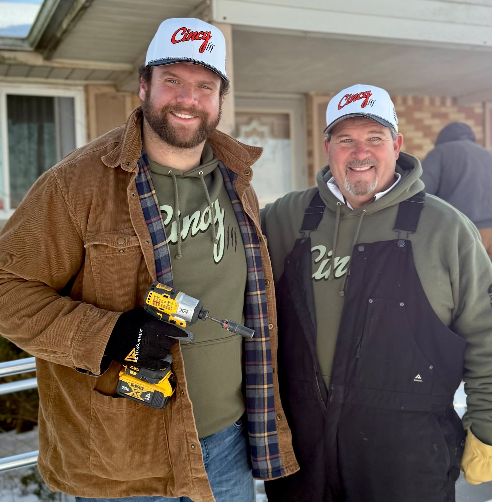 Cincinnati Bengals lineman Ted Karras, left, and Greg Schneider, founder of Operation Ramp It Up, helped build a ramp for a Trenton couple. SUBMITTED PHOTO