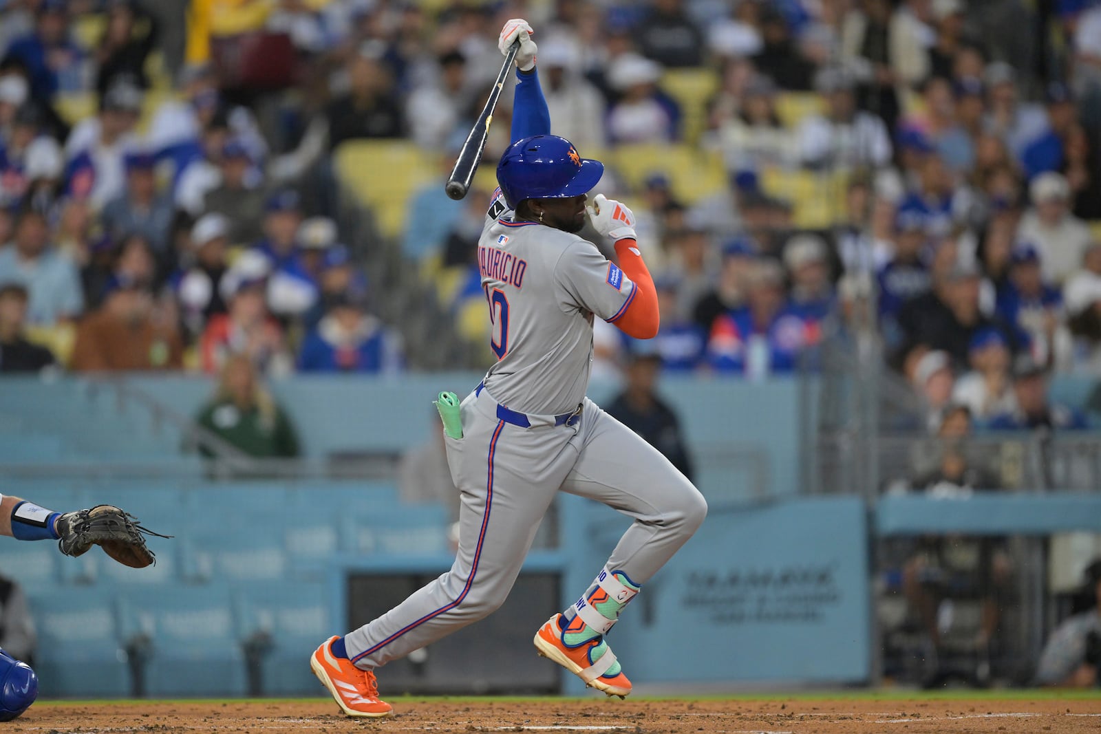 New York Mets' Ronny Mauricio grounds into a double play during the second inning of a baseball game against the Los Angeles Dodgers, Tuesday, June 3, 2025, in Los Angeles. (AP Photo/Jayne Kamin-Oncea)