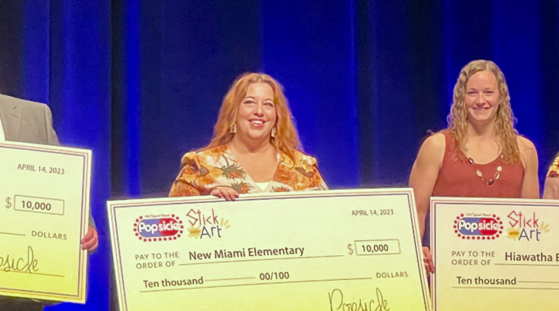 A New Miami Schools teacher’s idea to try a national art contest for the first time has turned into a $10,000 award for her art classes next school year and beyond. 	The competition, which was sponsored by the National Art Education Association (NAEA) and the Popsicle company, saw New Miami Elementary Art Teacher Andrea Ulreich recently travel to the association’s national conference in Texas to be presented with the $10,000. (Contributed Photo\Journal-News)