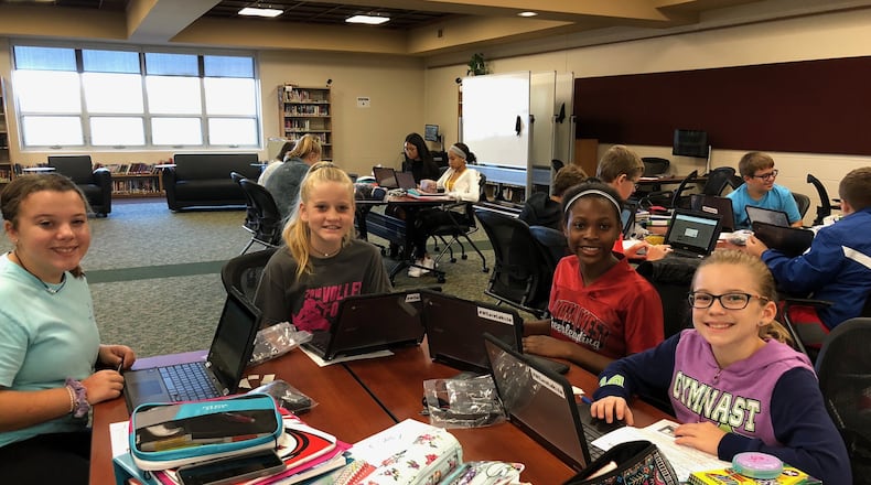 Students at Lakota Plains Junior School in Liberty Township are all smiles after receiving their Chromebooks as part of a historic pilot program to enhance student learning through the digital devices.