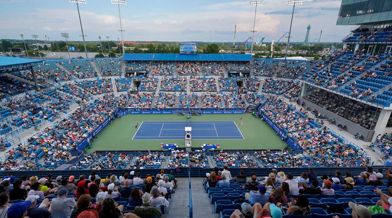 Borna Coric, left, of Croatia, serves to Stefanos Tsitsipas, of Greece, during the men's singles final of the Western & Southern Open tennis tournament Sunday, Aug. 21, 2022, in Mason, Ohio. ASSOCIATED PRESS FILE