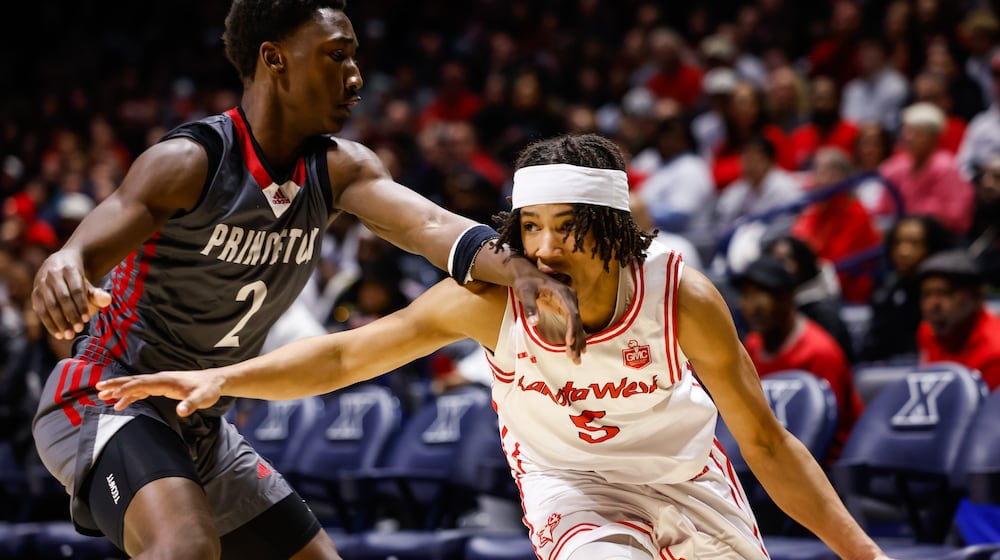 Lakota West's Andre Richardson dribbles the ball defended by Princeton's Jordan Johnson during their basketball game Friday, Feb. 6, 2026 at Xavier University's Cintas Center. Lakota West defeated Princeton 58-53. NICK GRAHAM/STAFF