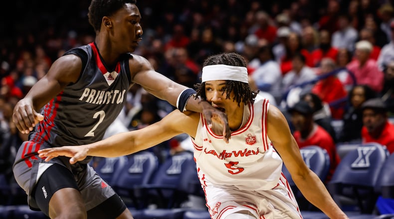 Lakota West's Andre Richardson dribbles the ball defended by Princeton's Jordan Johnson during their basketball game Friday, Feb. 6, 2026 at Xavier University's Cintas Center. Lakota West defeated Princeton 58-53. NICK GRAHAM/STAFF