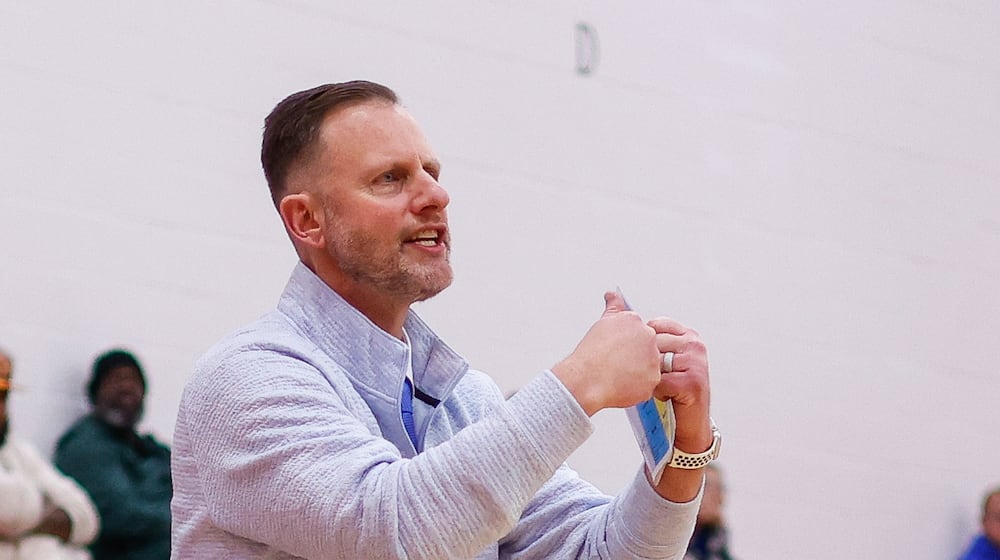 Middletown Christian's head coach Ryan Fairchild signals to his team during their basketball game Friday, Dec. 26, 2025 at the Brian Cook Classic basketball tournament at Madison High School. Norwood defeated Middletown Christian 58-40. NICK GRAHAM/STAFF