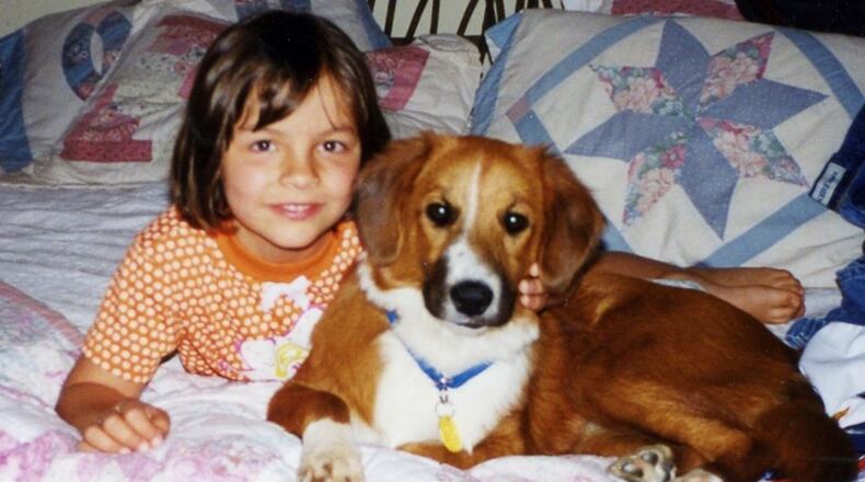 A young Jordan with her dog, Lucy. KARIN SPICER/CONTRIBUTED