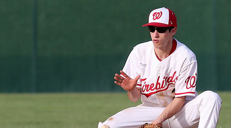 Lakota West second baseman Frankie Schmitt fields a Hamilton ground ball during their game in West Chester Township on April 2. CONTRIBUTED PHOTO BY E.L. HUBBARD