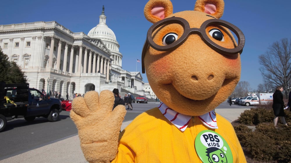 FILE - Arthur the Aardvark waves on Capitol Hill in Washington, Feb. 16, 2011, during a news conference to discuss the future of public broadcasting. (AP Photo/Harry Hamburg, File)