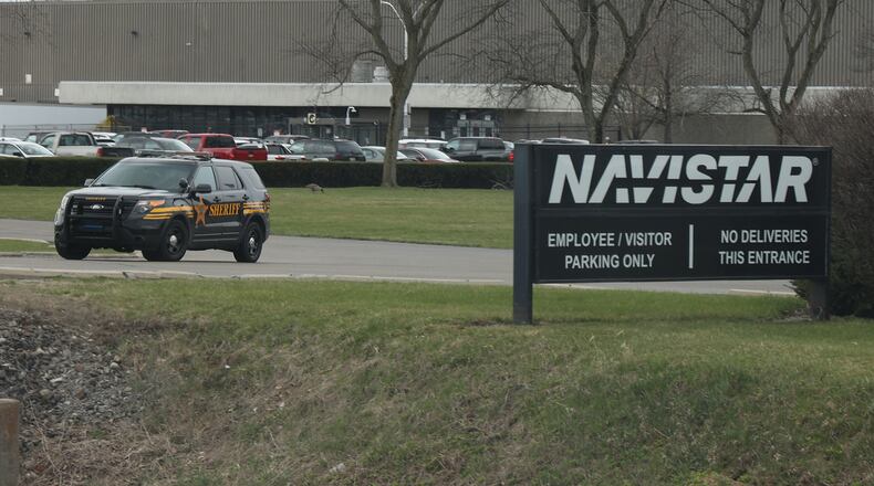 A Clark County Sheriff's cruiser leaves Navistar plant Thursday. BILL LACKEY/STAFF