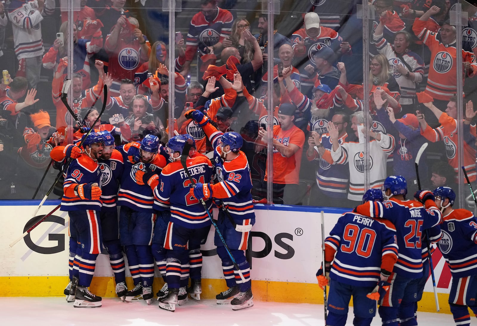 Edmonton Oilers' Leon Draisaitl (second left) celebrates his game-winning goal against the Florida Panthers with teammates in the first overtime period in Game 1 of the NHL Stanley Cup Final, in Edmonton, Alberta, on Wednesday, June 4, 2025. (Darryl Dyck/The Canadian Press via AP)