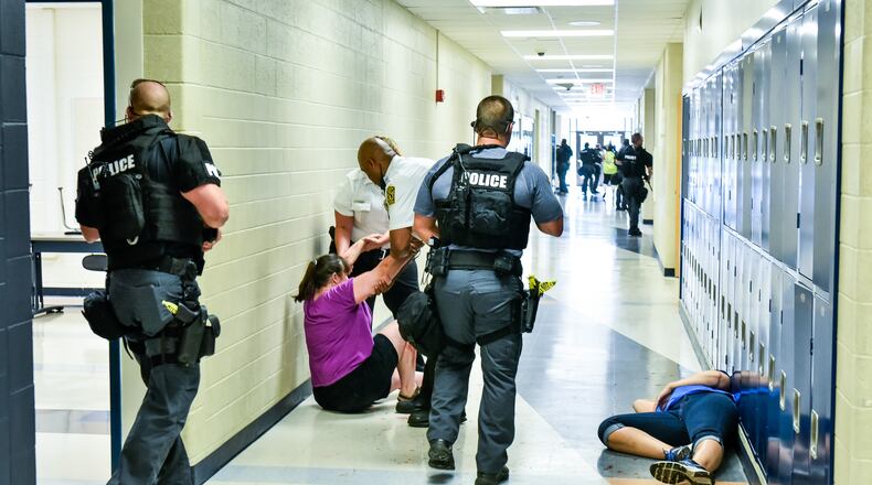 On July 18, Hamilton school and police officials will conduct a public forum to gauge opinions on adding armed school staffers to the 10,000-student city school system. The district recently held an active shooter training as part of its security preparation upgrades for the coming school year. NICK GRAHAM/STAFF
