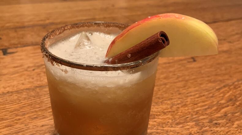 Bourbon or spiced dark rum, lemon juice, honey simple syrup and hard apple cider combine for the perfect fall brew. CONTRIBUTED