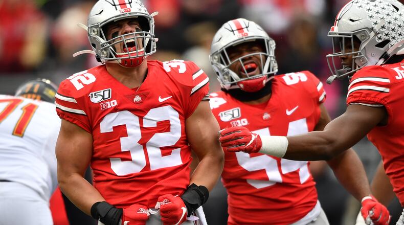 COLUMBUS, OH - NOVEMBER 9: Tuf Borland #32 celebrates a first quarter sack with Tyler Friday #54 of the Ohio State Buckeyes against the Maryland Terrapins at Ohio Stadium on November 9, 2019 in Columbus, Ohio. (Photo by Jamie Sabau/Getty Images)