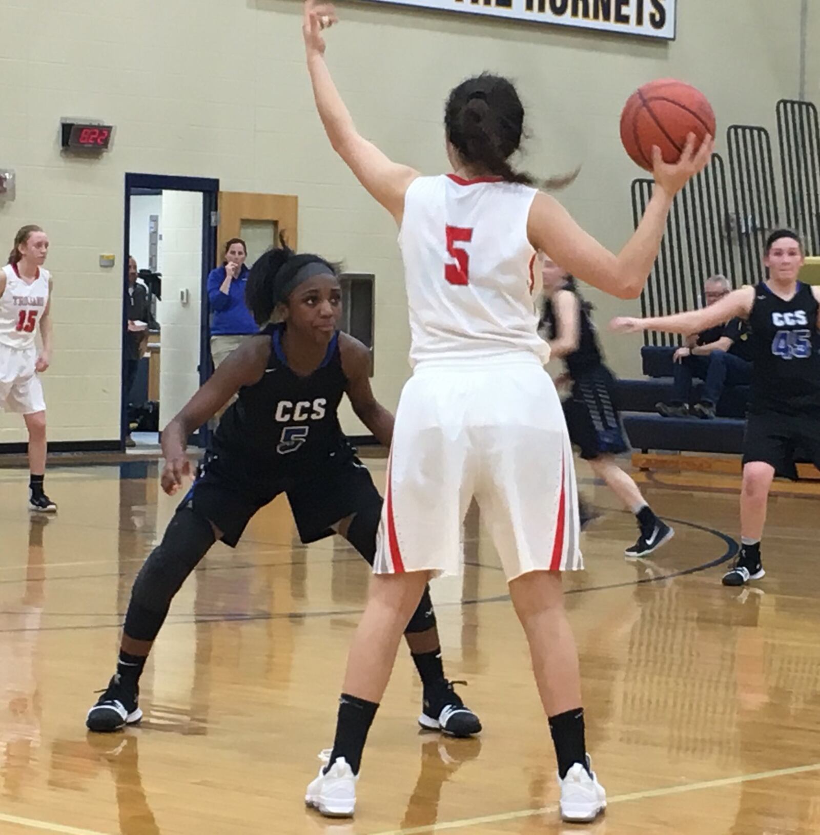 Cincinnati Christian’s Aaliyah Johnson (5, black jersey) defends South Charleston Southeastern’s Leslie Flores (5) during Thursday night’s Division IV sectional game at Monroe. RICK CASSANO/STAFF
