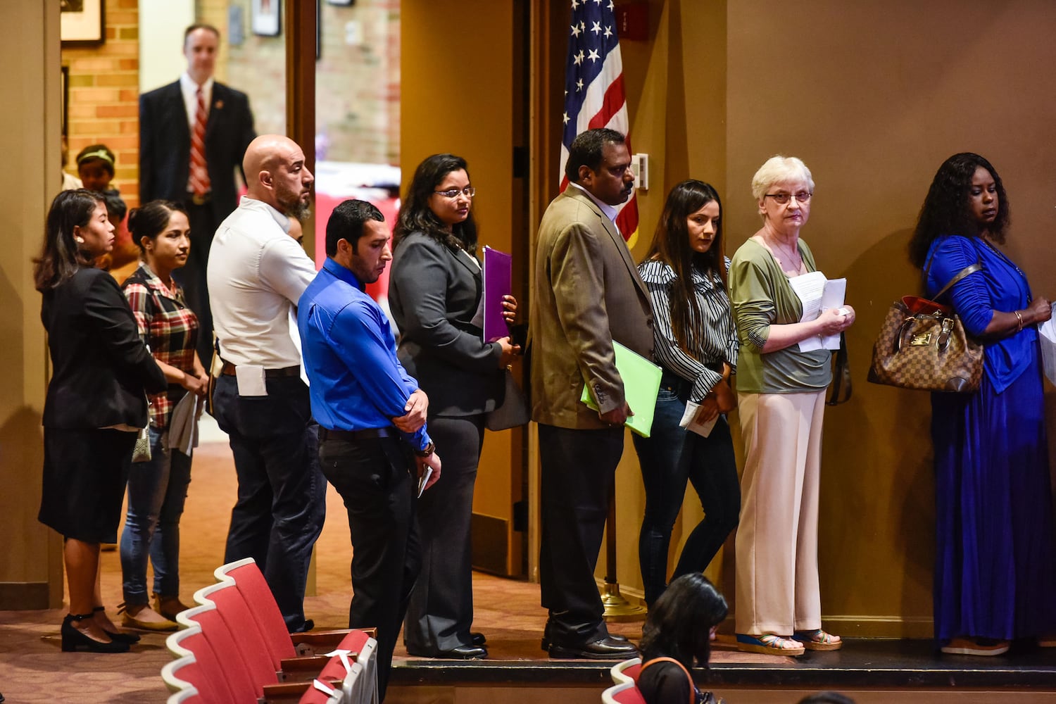 Nearly 100 people become U.S. citizens at naturalization ceremony at Miami Hamilton