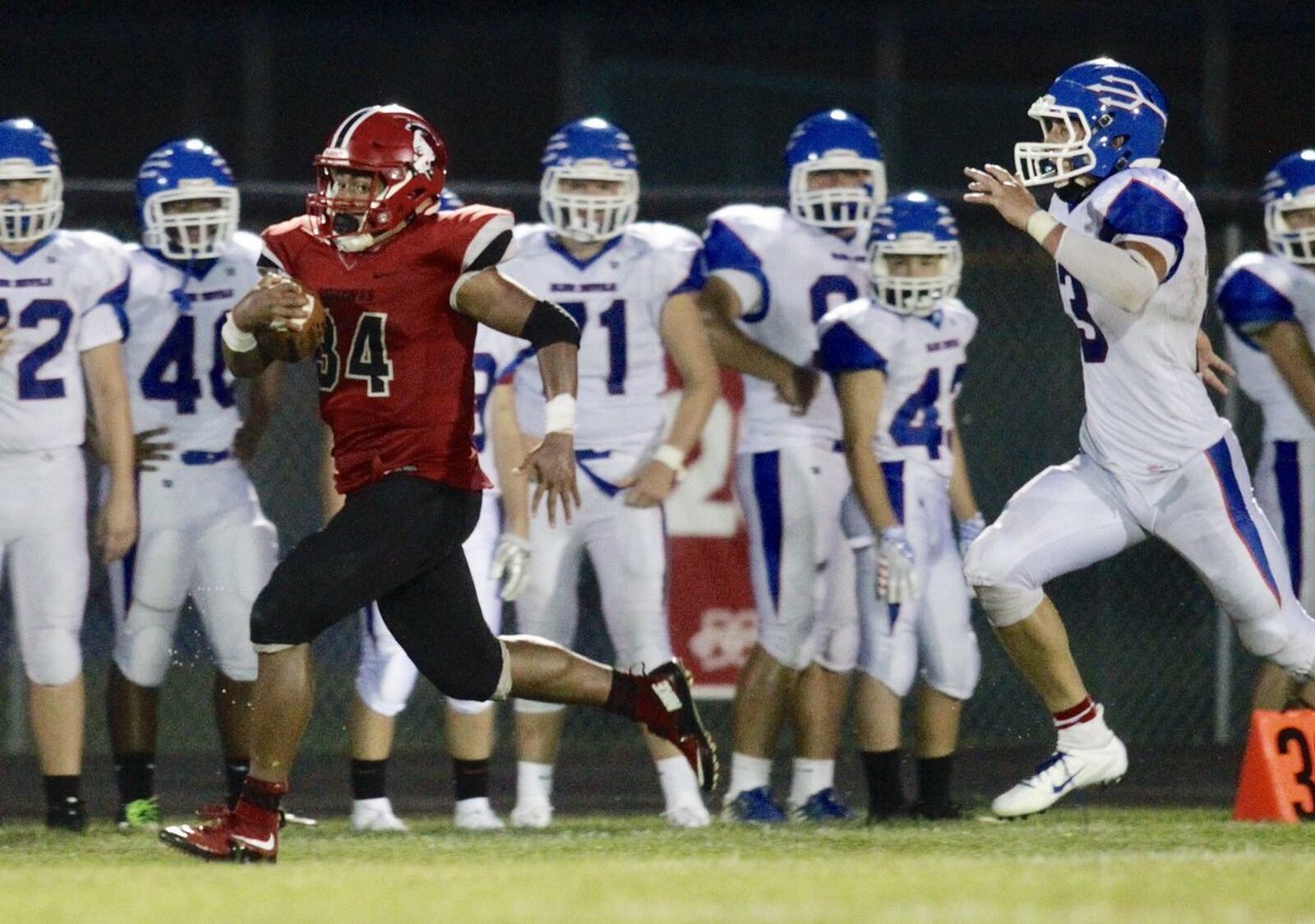 Madison’s Evan Crim runs away from the Reading defense during last Friday night’s game at Brandenburg Field in Madison Township. The host Mohawks won 46-0. NICK GRAHAM/STAFF