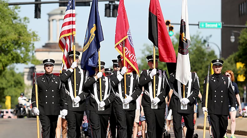 The Hamilton Fire Department Honor Guard leads the city’s 2016 Memorial Day parade down High Street. FILE PHOTO/2016