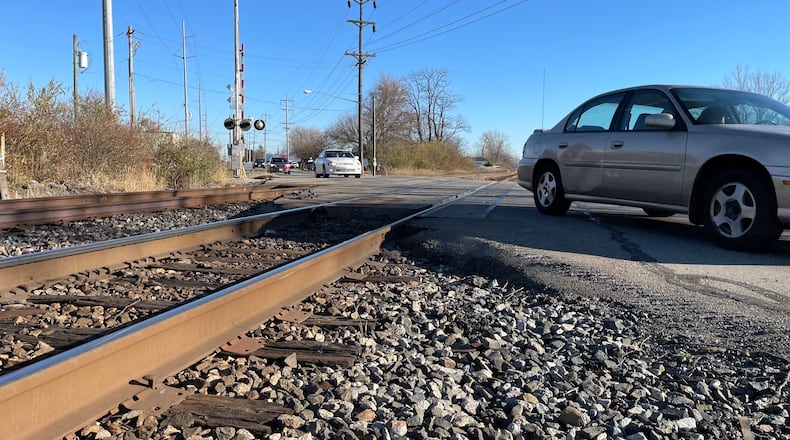 The city of Fairfield will be seeking additional funding sources to help construct a bridge to go over the Symmes Road railroad crossing just north of west of Industrial Drive. The project would not be unlike the South Hamilton Crossing project in Hamilton. Pictured is the railroad crossing on Monday, Nov. 21, 2022. MICHAEL D. PITMAN/STAFF