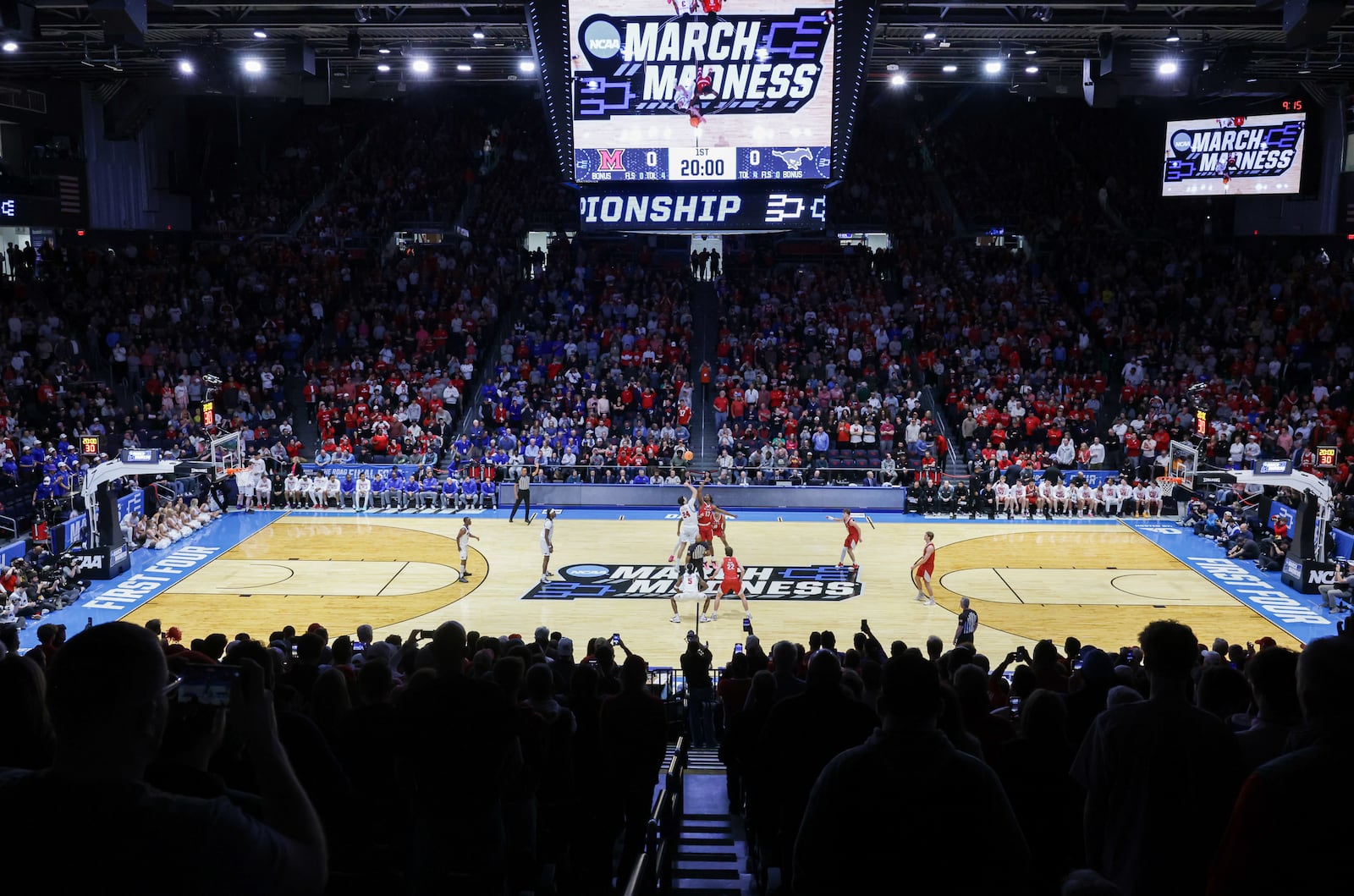 Miami and Southern Methodist University fight for the jump ball at tipoff in an NCAA First Four game on Wednesday, March 18 at University of Dayton Arena. BRYANT BILLING / STAFF