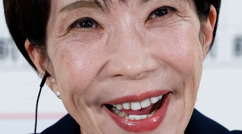 Sanae Takaichi, center, Japan's prime minister and president of the ruling Liberal Democratic Party (LDP), speaks during an interview at the LDP headquarters Sunday, Feb. 8, 2026 in Tokyo. (Kim Kyung-Hoon/Pool Photo via AP)