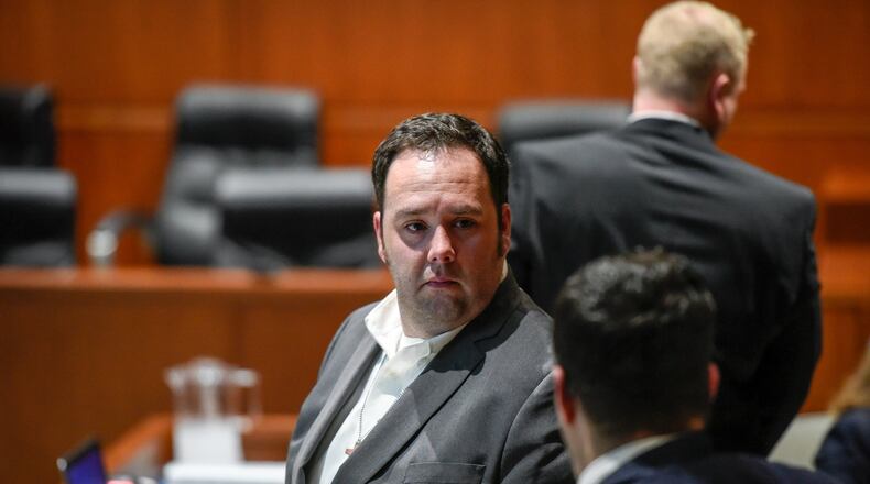 Robert Ritchie talks to his attorney Frank Schiavone IV on the first day of his second trial March 6 in Warren County Common Pleas Court. Ritchie is charged with child endangering and involuntary manslaughter in connection with the scalding death of his 4-year-old son. A mistrial was declared in December when a jury could not reach a verdict. NICK GRAHAM/STAFF