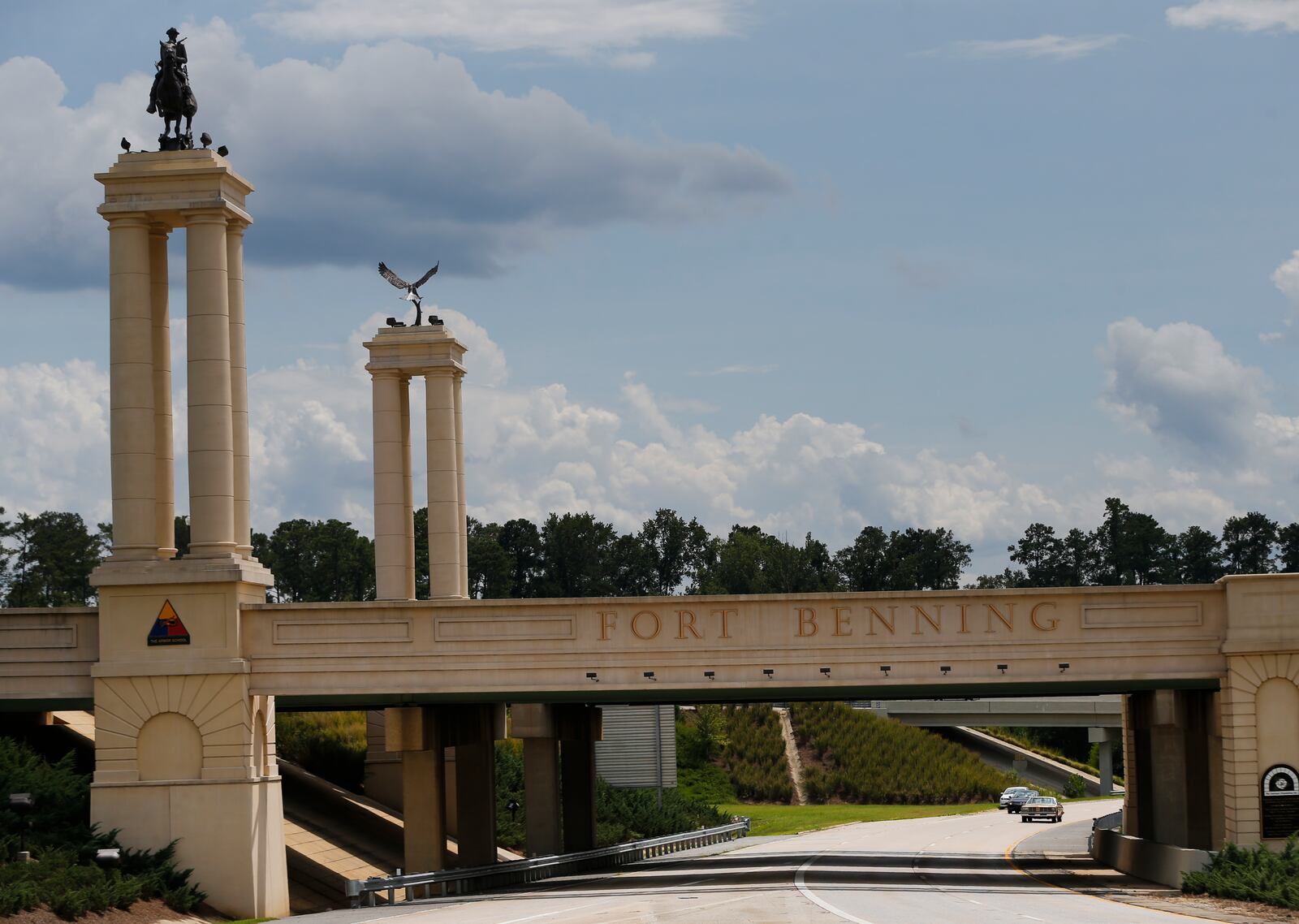 FILE - A bridge over I 185 marks the entrance to the U.S. Army's Fort Benning in Columbus, Ga., Aug. 21, 2015. (AP Photo/John Bazemore, file)