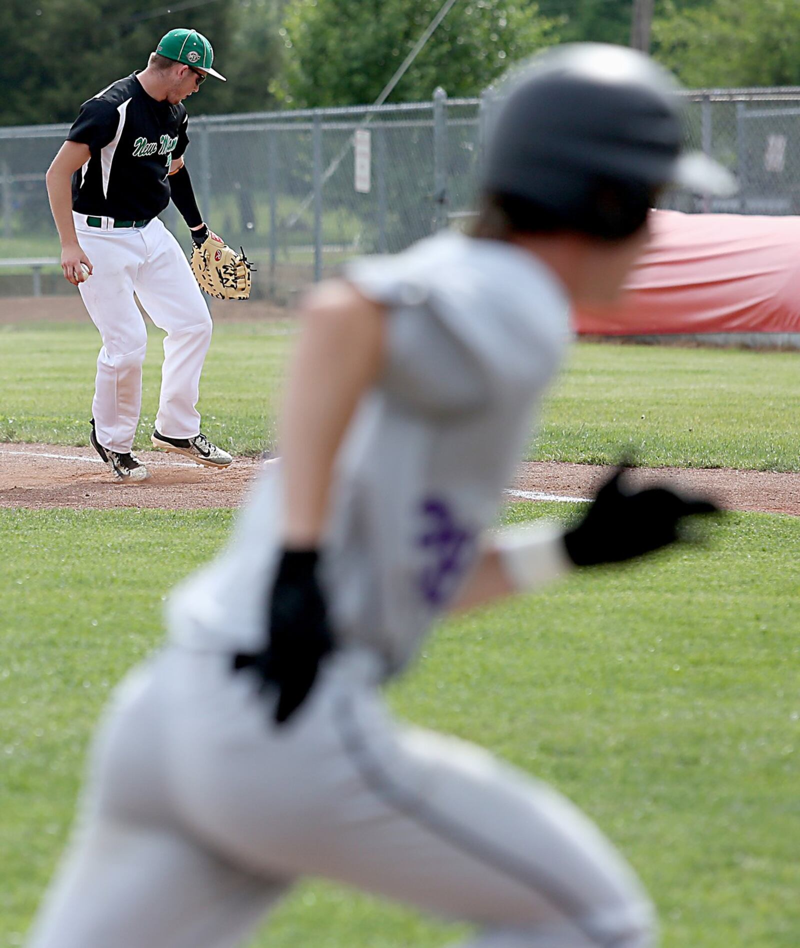 New Miami first baseman Ronnie Bowman tags first for the unassisted out during Wednesday’s Division IV sectional final against Miami Valley Christian Academy at Kings. CONTRIBUTED PHOTO BY E.L. HUBBARD