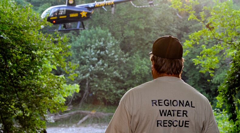In this 2012 file photo, rescue crews from the Butler County Sheriff’s Office and the county’s Emergency Management Agency search the Great Miami River after a report of a man falling in the water.