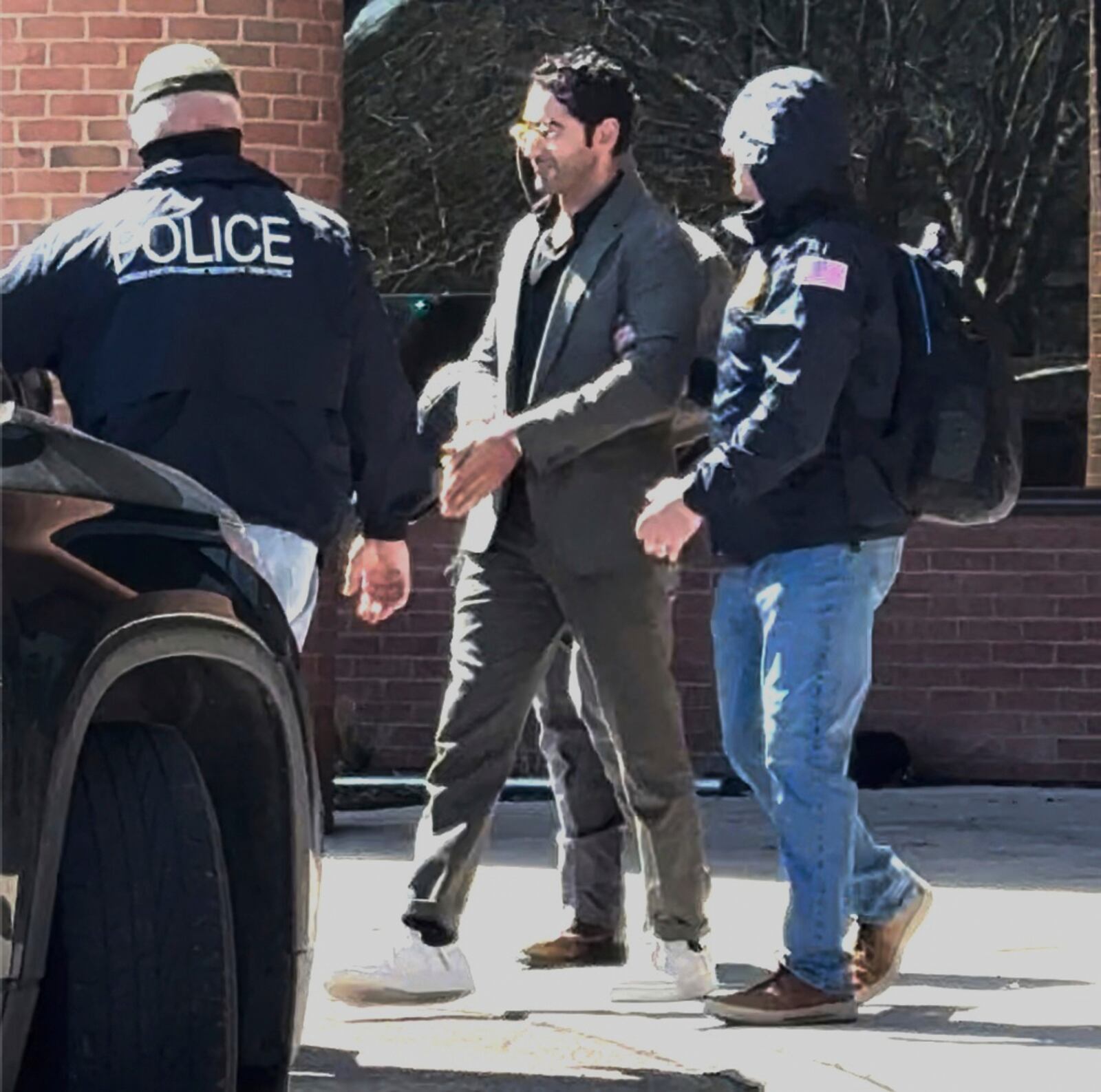 This image taken from a video provided by Christopher Helali shows Mohsen Mahdawi, a Palestinian man who led protests against the war in Gaza as a student at Columbia University, being detained at the U.S. Citizenship and Immigration Services office in Colchester, Vt., on Monday, April 14, 2025. (Christopher Helali via AP)