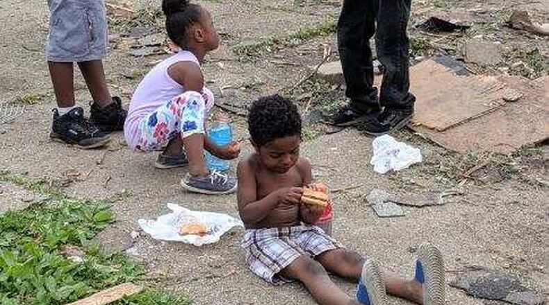 Children who live in one of the hardest hit areas in Trotwood were fed McDonald s hamburgers by Kingswell Seminary volunteers. SUBMITTED PHOTO