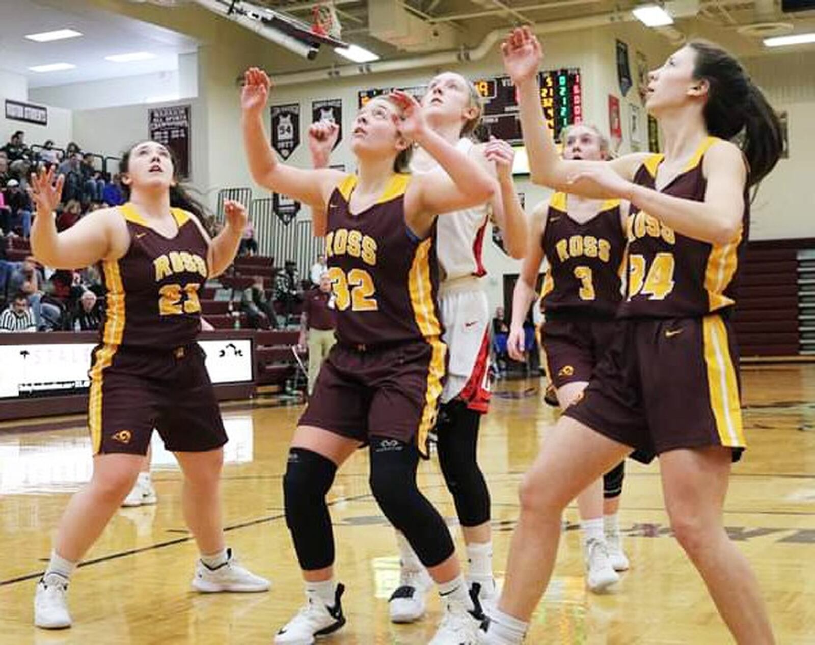 Franklin’s Jordan Rogers is surrounded by Kellan Romans (23), Dakota Snyder (32), Alexis Vangen (3) and Emma Harville (34) of Ross during Saturday afternoon’s Division II sectional opener at Lebanon. Franklin won 53-16. CONTRIBUTED PHOTO BY TERRI ADAMS