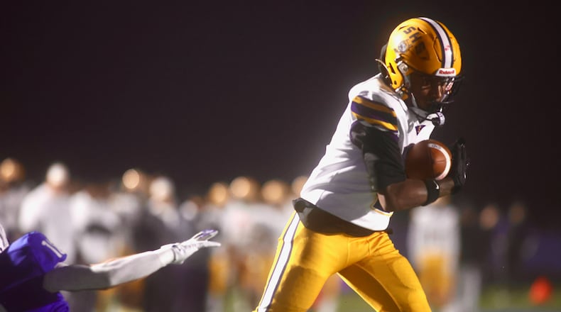 Springfield's Sherrod Lay Jr. catches a touchdown pass against Springboro in the second quarter in the second round of the Division I, Region 2 playoffs on Friday, Nov. 7, 2025, at CareFlight Field in Springboro. David Jablonski/Staff