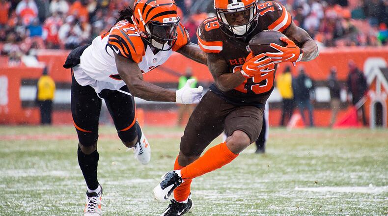 CLEVELAND, OH - DECEMBER 11: Cornerback Dre Kirkpatrick #27 of the Cincinnati Bengals tackles wide receiver Corey Coleman #19 of the Cleveland Browns during the second half at FirstEnergy Stadium on December 11, 2016 in Cleveland, Ohio. The Bengals defeated the Browns 23-10. (Photo by Jason Miller/Getty Images)