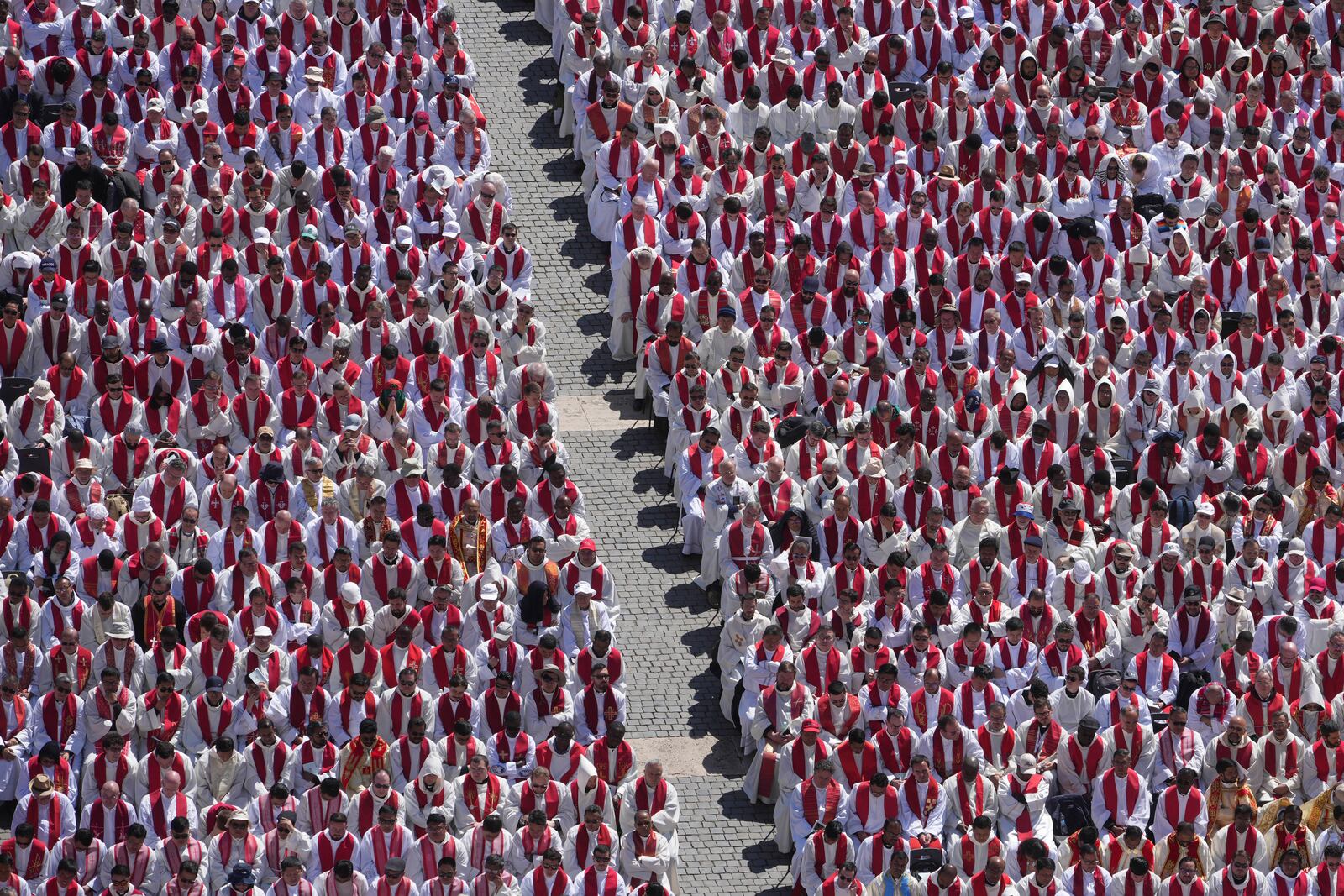 Clergy follow the funeral of Pope Francis in St. Peter's Square at the Vatican, Saturday, April 26, 2025. (AP Photo/Alessandra Tarantino)