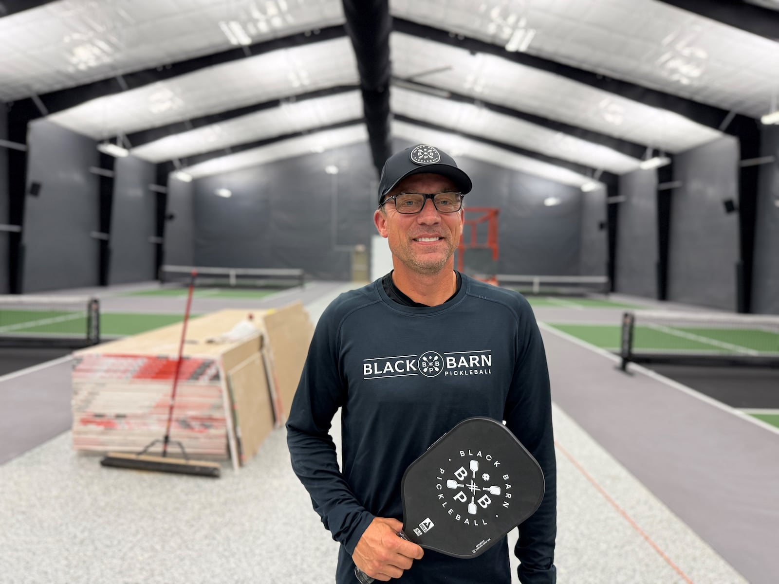 Mike Bettencourt, co-founder of Black Barn Pickleball, inside the new facility at 4740 Linden Ave. in Riverside. The building has eight indoor pickleball courts. CORNELIUS FROLIK / STAFF