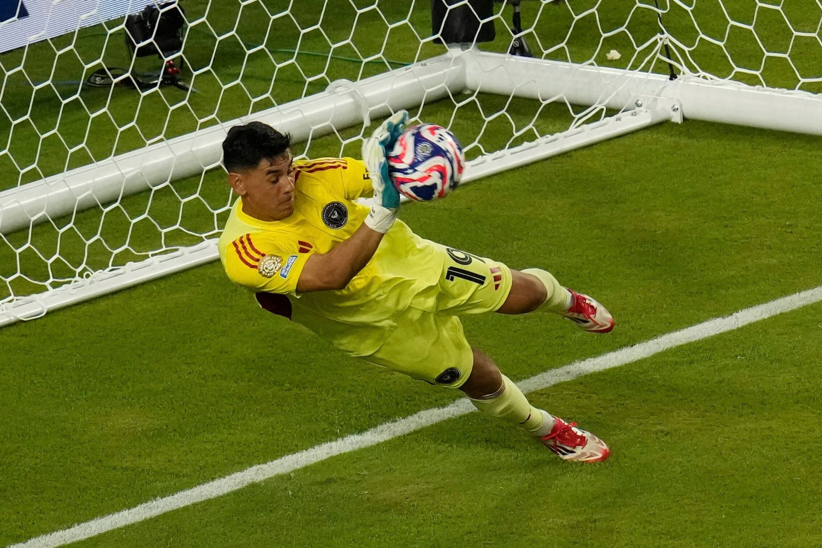 Inter Miami's Oscar Ustari saves a penalty from Al Ahly's Trezeguet during the Club World Cup group A soccer match between Al Ahly and Inter Miami in Miami, Fla., Saturday, June 14, 2025. (AP Photo/John Raoux)