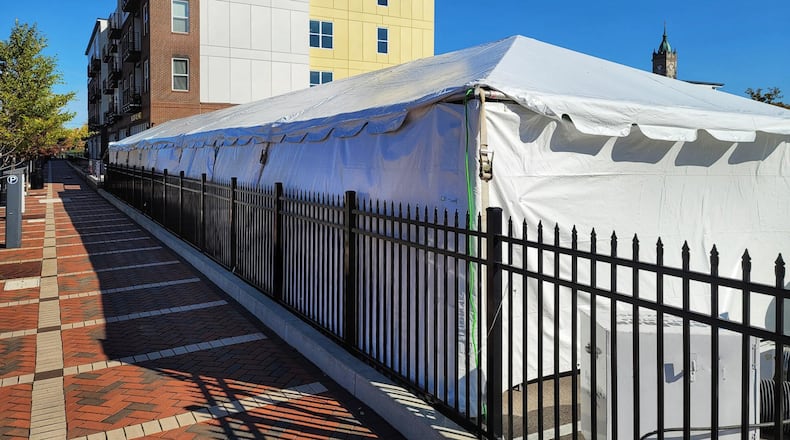 The Casual Pint Hamilton, 130 Riverfront Plaza, has opened a tent to expand its capacity as a way to serve customers through the winter. NICK GRAHAM/STAFF