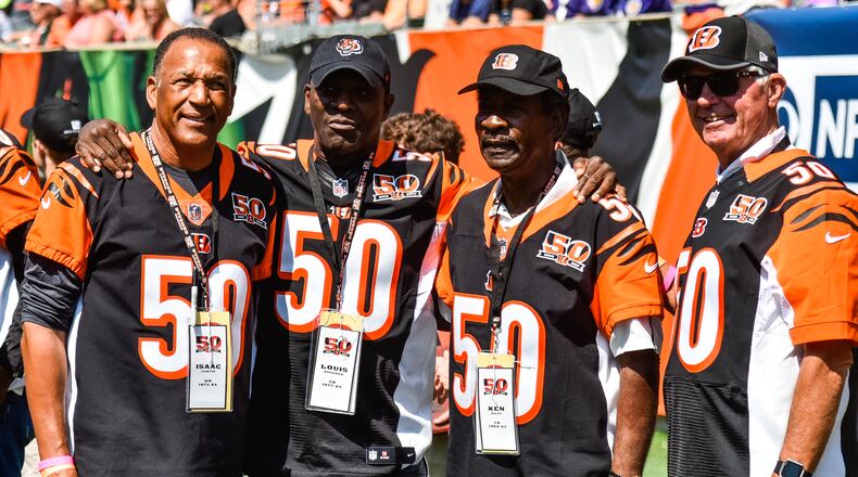 Former Bengals players (L to R) Isaac Curtis, Louis Breeden, Ken Riley and Ken Anderson gather before they are recognized at halftime on Sept. 10, 2017, at Paul Brown Stadium in Cincinnati. Riley, who played 15 seasons for the Bengals, died Sunday. He was 72. NICK GRAHAM/STAFF