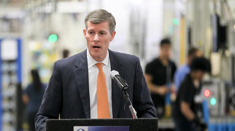 JobsOhio has made funds available for several new local projects. Here, John Minor, president of JobsOhio, spoke at the 2014 groundbreaking for the expansion at ThyssenKrupp Bilstein of America. GREG LYNCH / STAFF