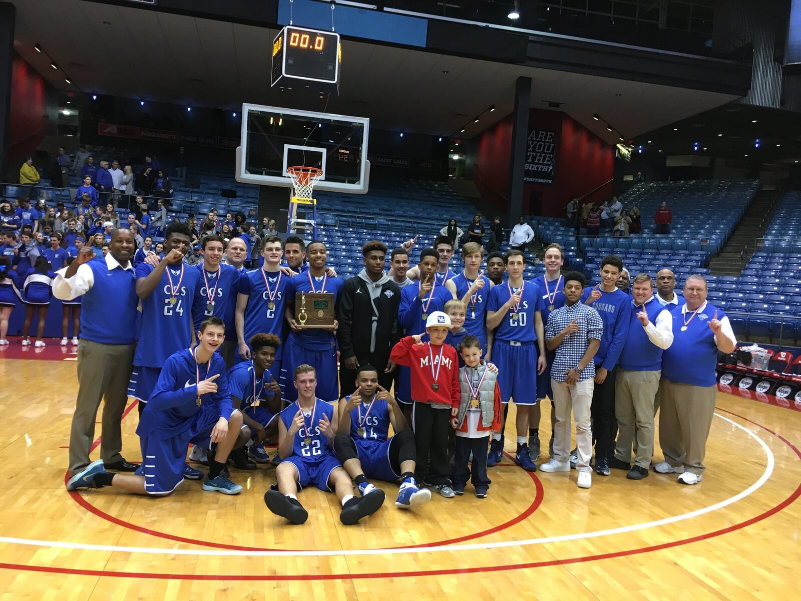 Cincinnati Christian poses for a team photo after Friday night’s 54-52 victory over South Charleston Southeastern in a Division IV district final at the University of Dayton Arena. RICK CASSANO/STAFF