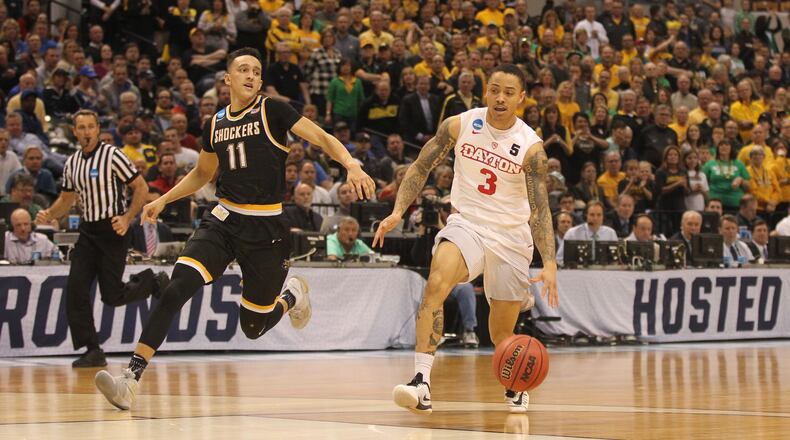 Dayton’s Kyle Davis dribbles to the basket against Wichita State in the NCAA tournament on March 17, 2017, at Bankers Life Fieldhouse in Indianapolis. David Jablonski/Staff