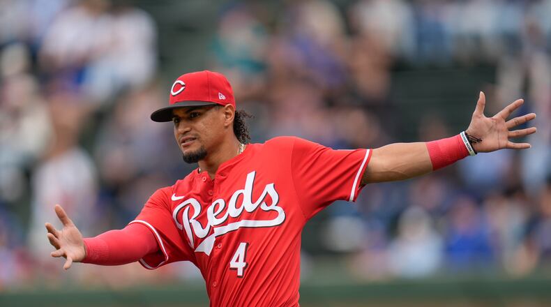 Cincinnati Reds' Santiago Espinal warms up before a baseball game against the Chicago Cubs, Friday, Sept. 27, 2024, in Chicago. (AP Photo/Erin Hooley)